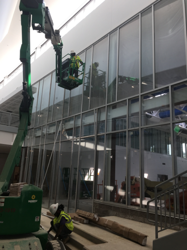 EGM workers using crane to install windows