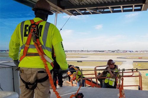 EGM employee overseeing workers at job site